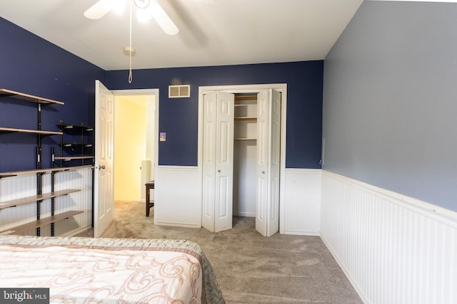 bedroom featuring light colored carpet and ceiling fan