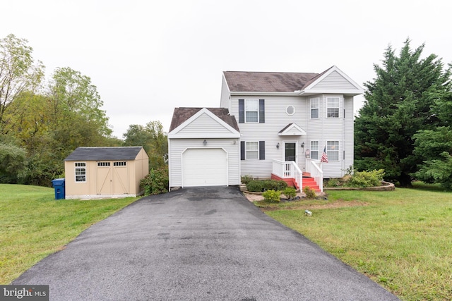 view of front of home with a front lawn, a garage, and a storage shed