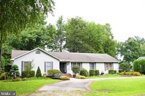 ranch-style home with a front yard