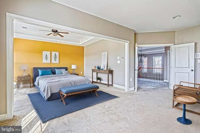 carpeted bedroom with ceiling fan and ornamental molding