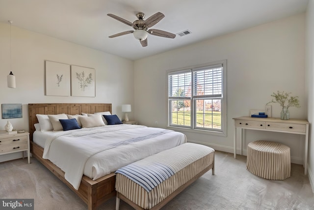 bedroom with light carpet and ceiling fan