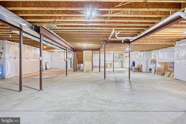 basement featuring electric panel