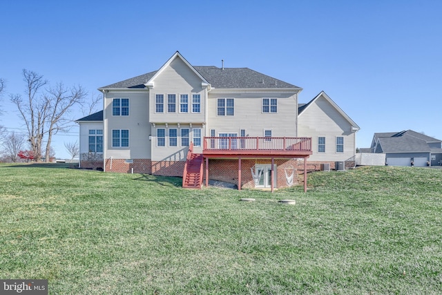 rear view of property featuring a yard and a deck