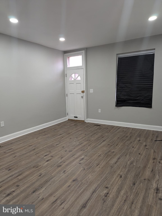 entrance foyer with dark hardwood / wood-style floors