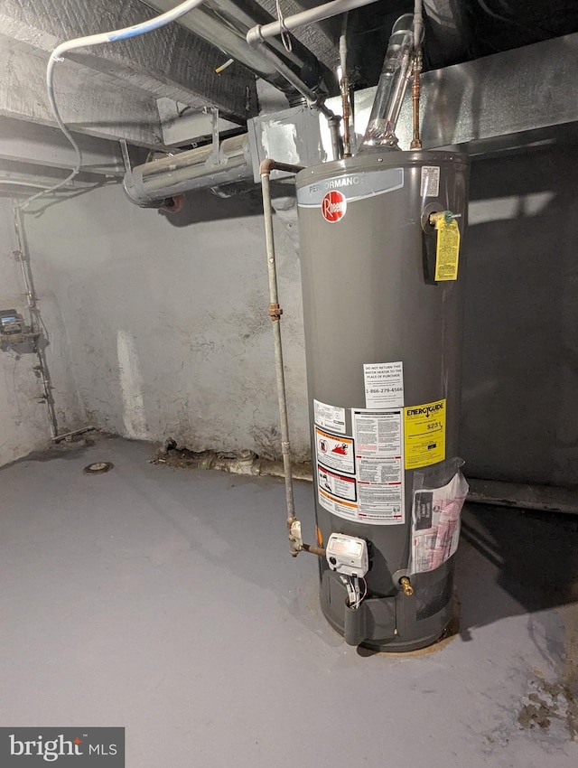 utility room featuring water heater