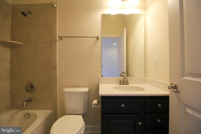 full bathroom featuring vanity, toilet, and tiled shower / bath