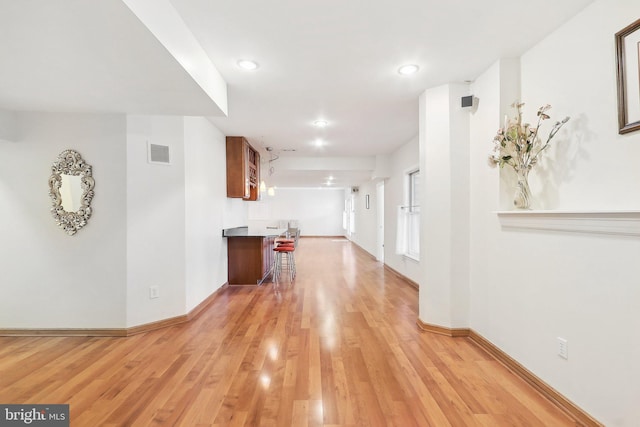 hallway featuring light wood-type flooring