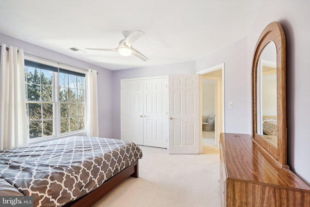 bedroom with carpet floors, a closet, and ceiling fan