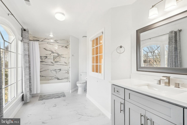 full bathroom featuring vanity, toilet, and shower / tub combo with curtain