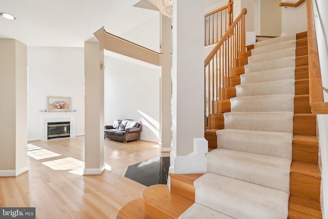 stairway featuring hardwood / wood-style floors