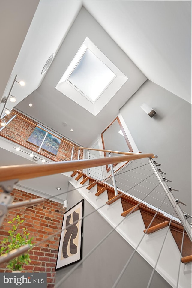 staircase with lofted ceiling