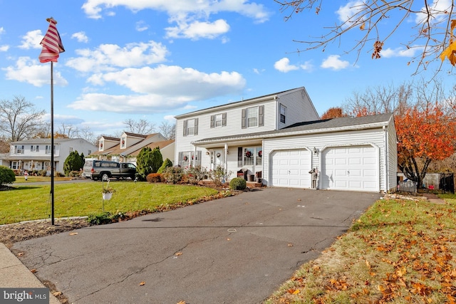 view of front facade with a garage and a front lawn