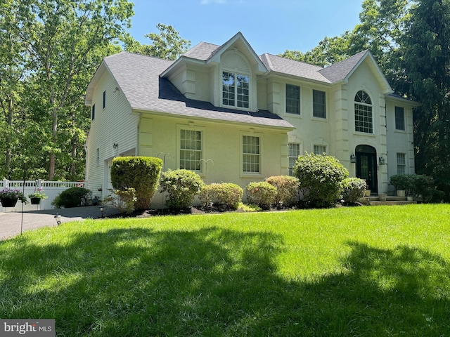 view of front of home with a front lawn