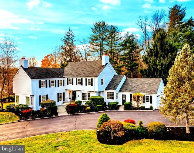 189 Constitution Dr, Princeton, NJ 08540 - view of front of property featuring a chimney, driveway, and a front lawn