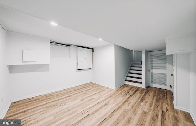 189 Constitution Dr, Princeton, NJ 08540 - finished below grade area with light wood finished floors, stairway, baseboards, and recessed lighting