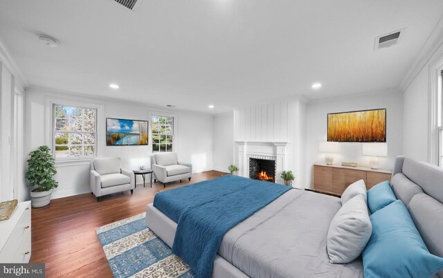 189 Constitution Dr, Princeton, NJ 08540 - bedroom featuring ornamental molding, a fireplace, wood finished floors, recessed lighting, and baseboards