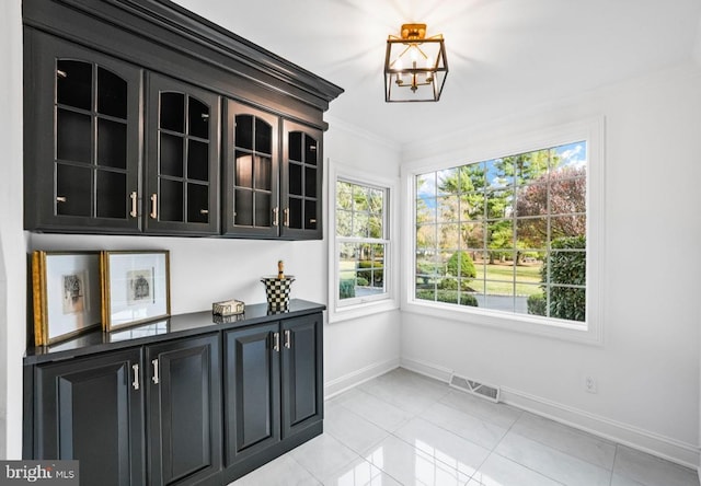 189 Constitution Dr, Princeton, NJ 08540 - unfurnished dining area with baseboards, ornamental molding, and light tile patterned flooring