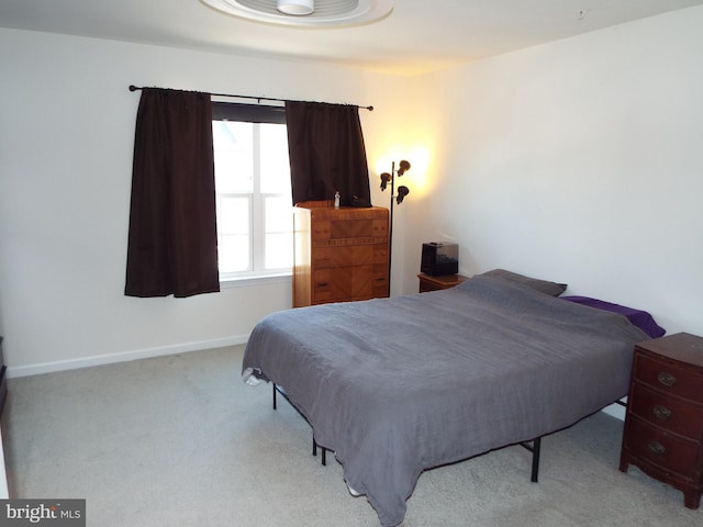 bedroom with light carpet