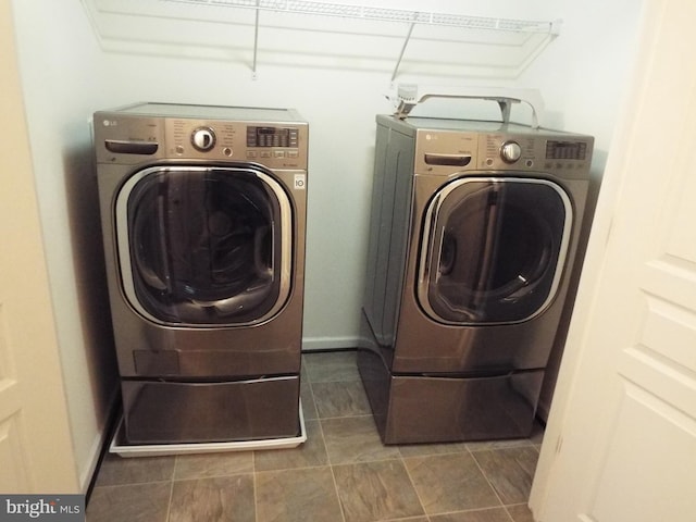 washroom with washing machine and dryer