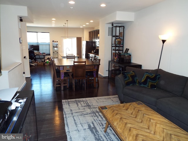 living room featuring dark hardwood / wood-style flooring