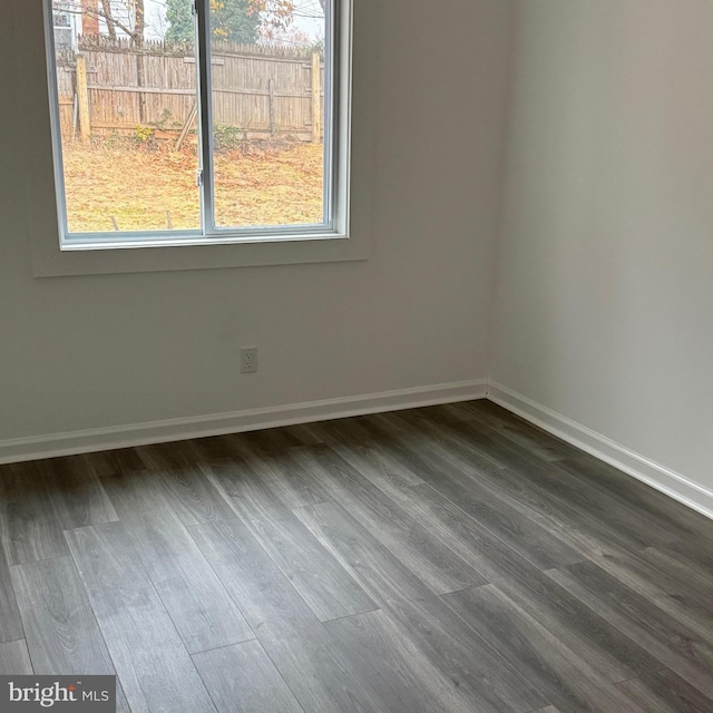 unfurnished room with hardwood / wood-style floors