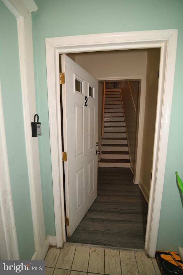 stairway featuring hardwood / wood-style floors