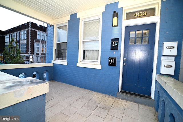 doorway to property featuring a porch