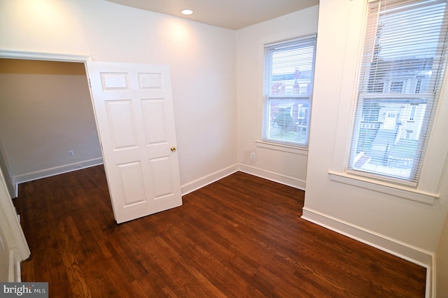 empty room featuring dark hardwood / wood-style floors