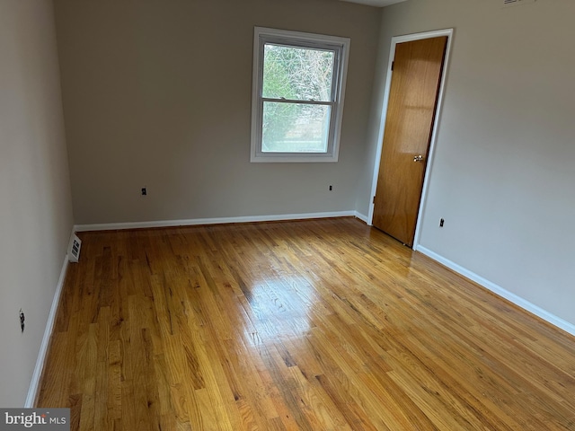 empty room with light wood-type flooring