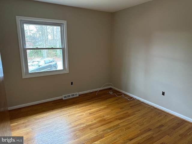 unfurnished room featuring light hardwood / wood-style floors