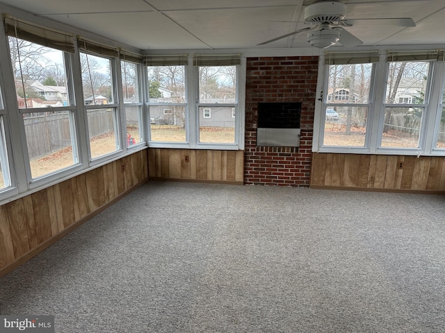 unfurnished sunroom with plenty of natural light and ceiling fan