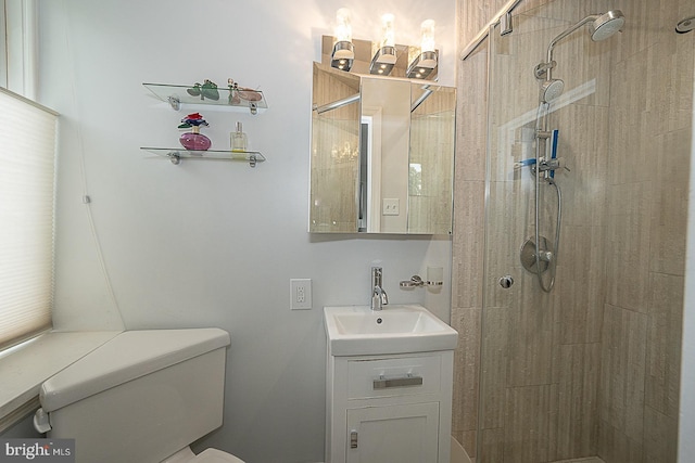 full bath with toilet, a stall shower, and vanity