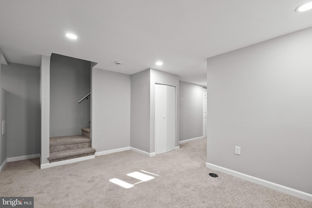 basement with light colored carpet