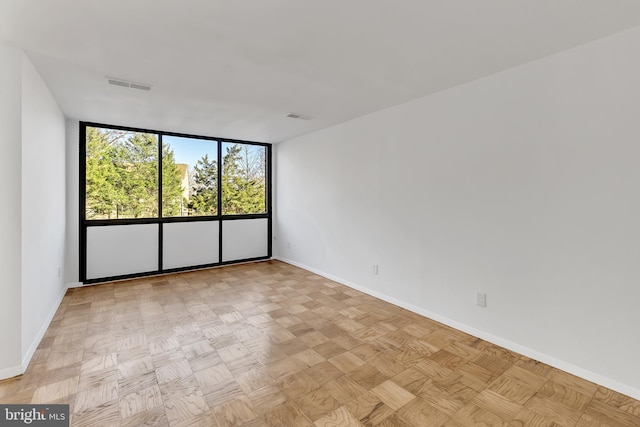 spare room featuring light parquet flooring