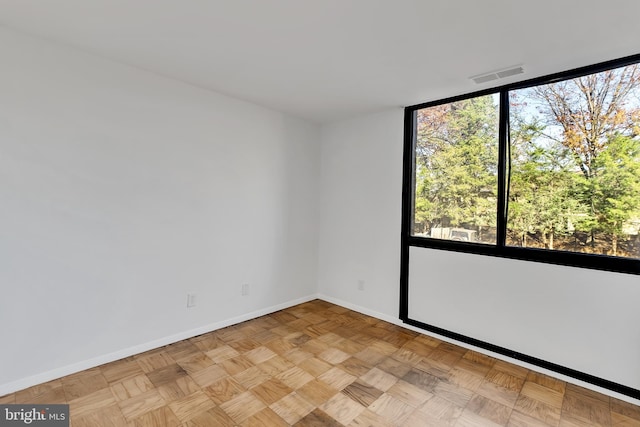 empty room featuring light parquet flooring