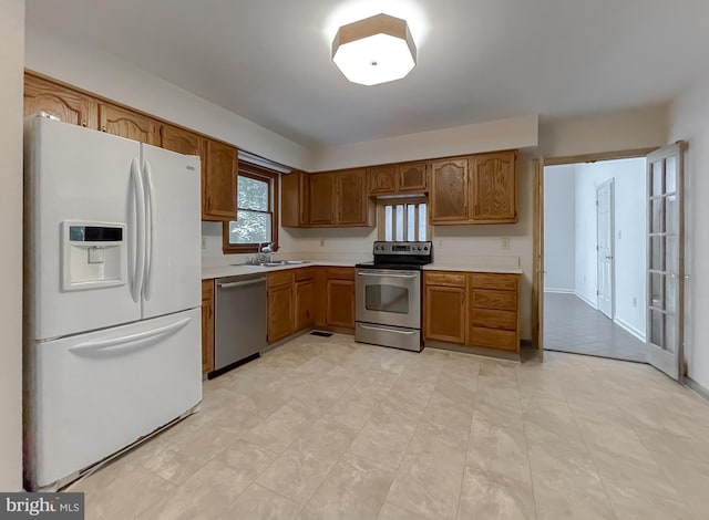 kitchen featuring appliances with stainless steel finishes and sink