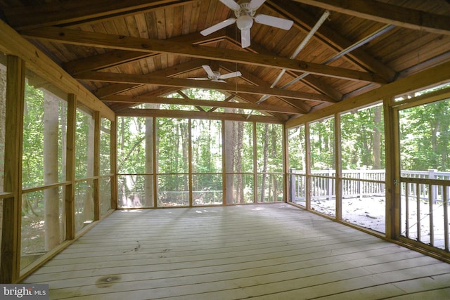 unfurnished sunroom with ceiling fan and lofted ceiling