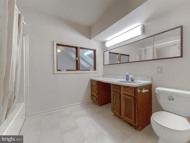 full bathroom featuring toilet, vanity, and shower / tub combo with curtain