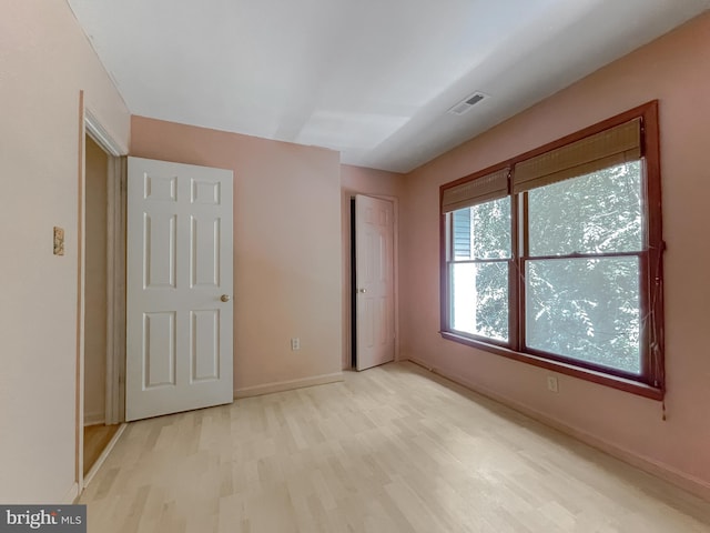 unfurnished bedroom with light hardwood / wood-style floors