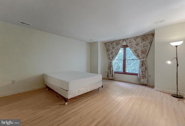 unfurnished bedroom with light hardwood / wood-style flooring