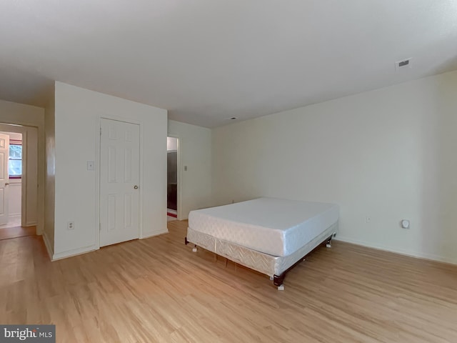 unfurnished bedroom with light hardwood / wood-style flooring