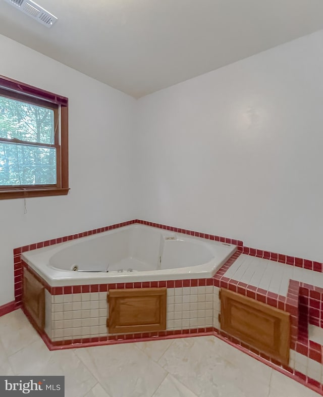 bathroom featuring tiled bath