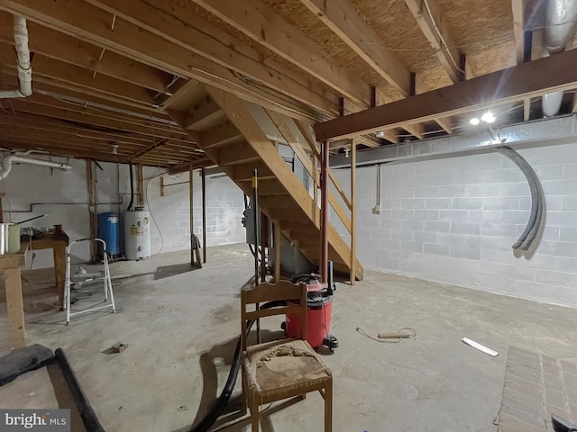 basement featuring water heater and gas water heater