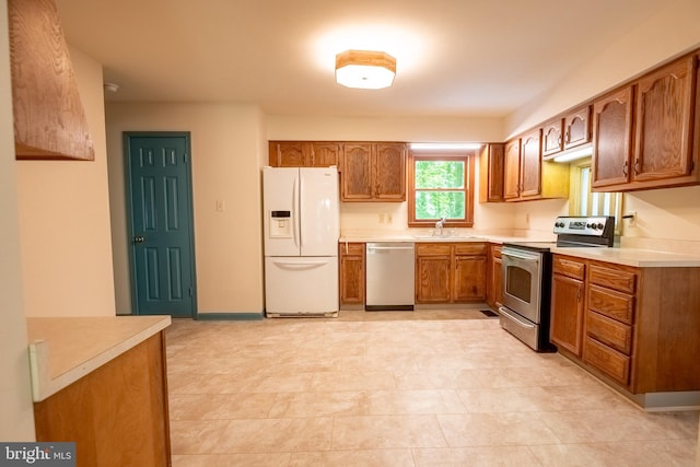 kitchen featuring appliances with stainless steel finishes and sink