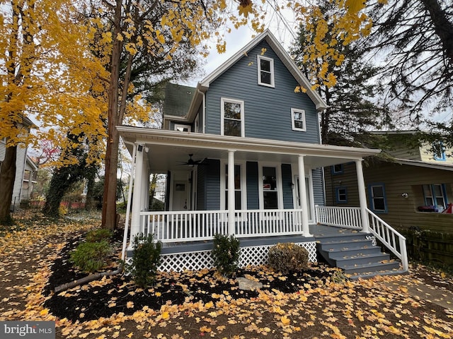 farmhouse featuring a porch and ceiling fan