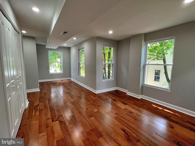 empty room with hardwood / wood-style flooring