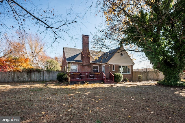 back of property with a deck