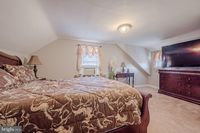 carpeted bedroom with cooling unit and vaulted ceiling