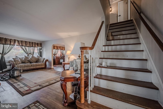 staircase featuring hardwood / wood-style floors