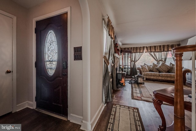 foyer entrance featuring dark wood-type flooring